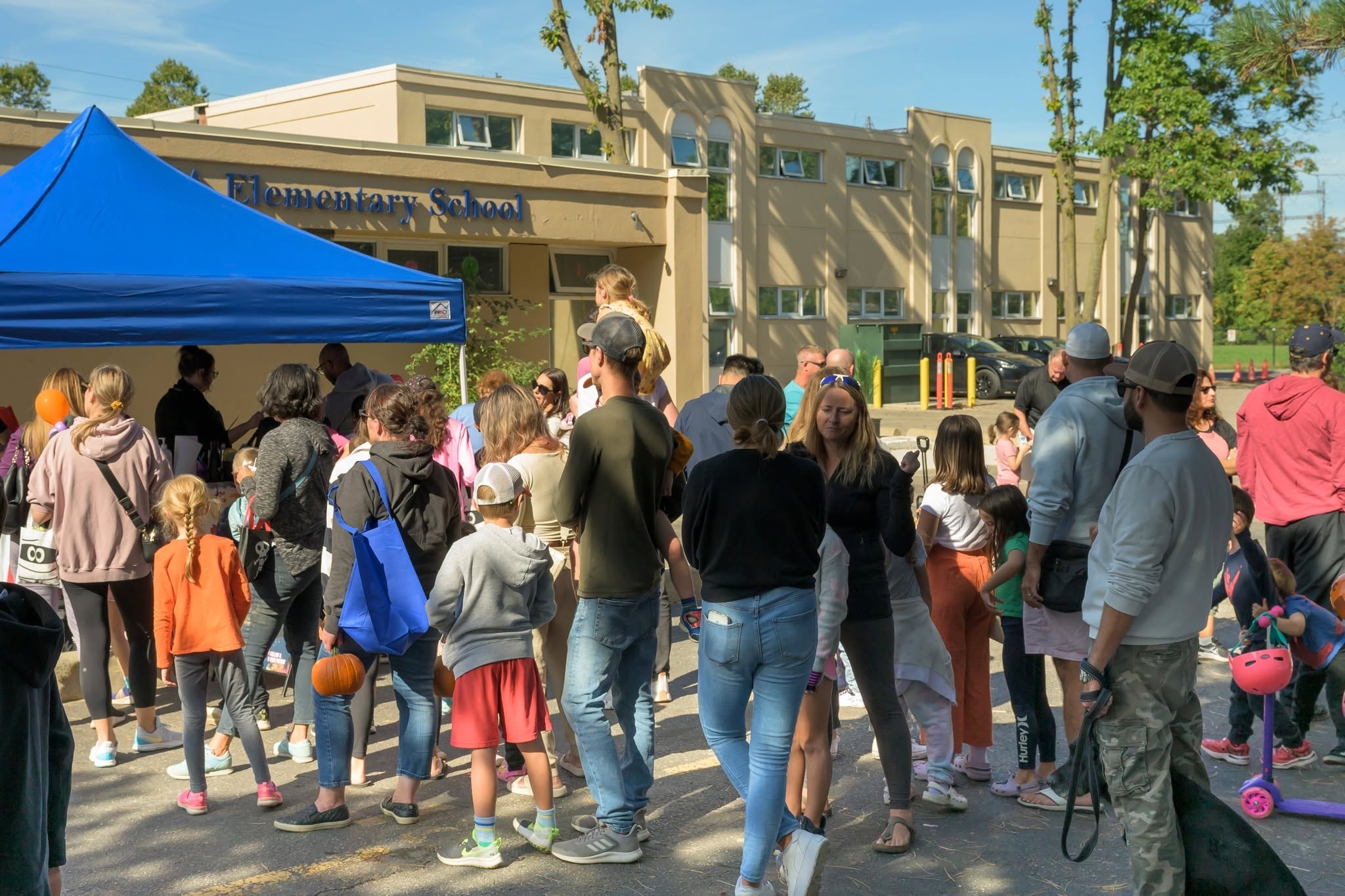 Crowd of Sherway residents gathered at the Pumpkin Giveaway at ISNA Elementary School